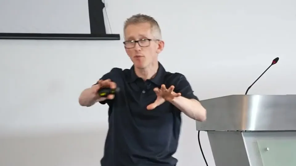 Andrew Pain speaking at his burnout talk, March 2026