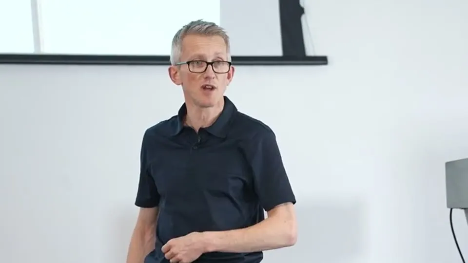 Andrew Pain speaking at his burnout talk, March 2026